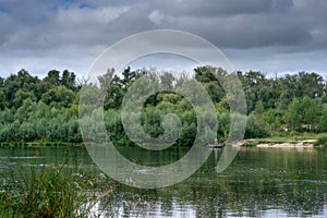 Beautiful view of Ukrainian Desna river, calm waters, dramatic skies