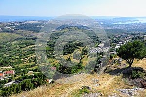 A beautiful view of a valley full of farmland outside of Split, Croatia in Klis.  The view is high above from the Klis fortress.