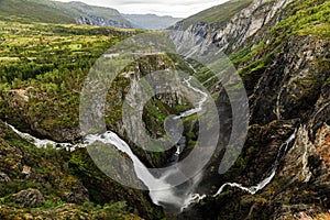 Beautiful view of the Voringsfossen waterfall. Picturesque mountain landscape with waterfalls.