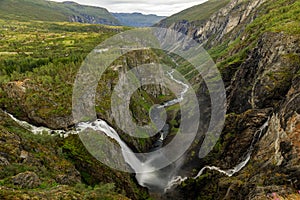 Beautiful view of the Voringsfossen waterfall. Picturesque mountain landscape with waterfalls.