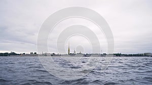 Beautiful view of water and Peter and Paul fortress in cloudy weather. Action. Peter and Paul fortress is oldest