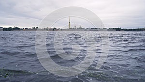 Beautiful view of water and Peter and Paul fortress in cloudy weather. Action. Peter and Paul fortress is oldest