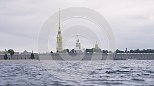 Beautiful view of water and Peter and Paul fortress in cloudy weather. Action. Peter and Paul fortress is oldest