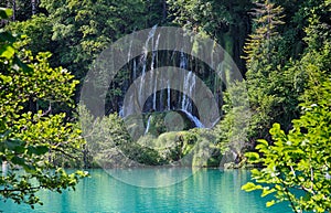 The beautiful view of waterfalls in Plitvice lakes . The water is clear and turquoise