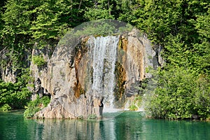 The beautiful view of waterfalls in Plitvice lakes . The water is clear and turquoise