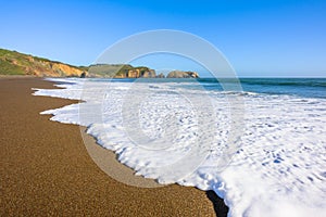 Beautiful view on a wave and ocean wild shore