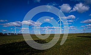 Beautiful view of wind turbines under a cloudy sky