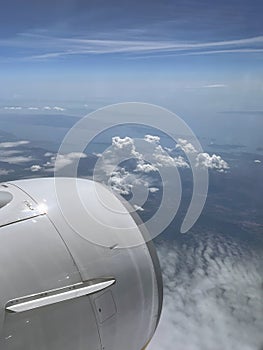 Beautiful View from Window of Airplane in The Sky. Flying and Traveling,View from Airplane Window on the Wing. Aerial View From