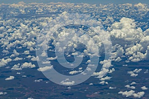 Beautiful view from window of plane flying over clouds. Natural panorama with clouds.