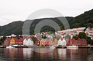 Beautiful view of wooden colored houses on the coast  in Bergen, Norway