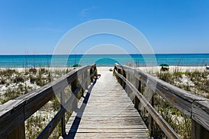 Beautiful view of a wooden path going to Henderson Beach State Park Destin in the USA photo