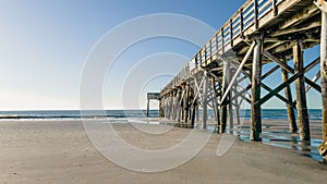Beautiful view of wooden pier on Isle of Palms beach, Charleston photo