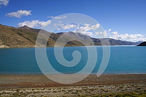 Beautiful view of the Yamdrok Lake on a mountains background