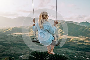 Beautiful view of young woman swing on the top of the mountan Redonda in Dominican Republic. Concept travel, vacation