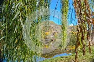 Beautiful views of the autumn river Berounka willow, forest and mountains,Czech.