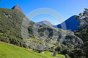 Beautiful views from Fosserasa hiking trail of mountains, Villages and valley landscape close to Geiranger fjord, Norway. photo