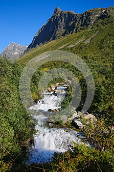 Beautiful views from FosserÃÂ¥sa hiking trail of StorsÃÂ¦terfossen waterfall. Close to Geiranger fjord, Norway. photo