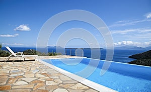 Beautiful views of the infinity pool by the sea photo