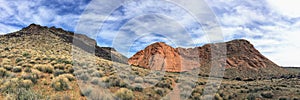 Views of sandstone and lava rock mountains and desert plants around the Red Cliffs National Conservation Area on the Yellow Knolls