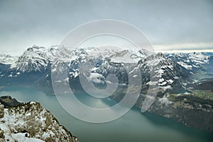 Beautiful views on snowy Alps as seen from top of Fronalpstock