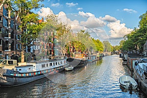 Beautiful views of the streets, ancient buildings, people, embankments of Amsterdam