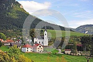 Beautiful village with a church in mountains