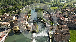 Beautiful village on the river bank aerial view of the mill village of Borghetto sul Mincio in the south of Lake Garda photo