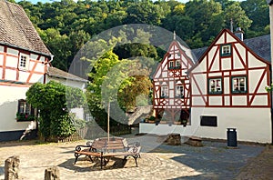 Beautiful villages: Half timbered houses and a bench inMonreal in rhineland-palatinate