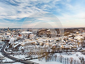 Beautiful Vilnius city panorama in winter with snow covered houses, churches and streets. Aerial view. Winter city scenery in