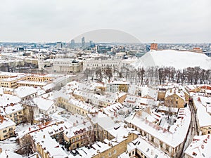 Beautiful Vilnius city panorama in winter with snow covered houses, churches and streets. Aerial view. Winter city scenery in