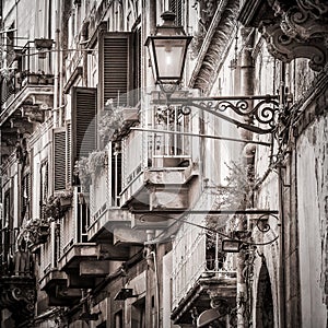 Beautiful vintage balconies and street lamp in old mediterranean