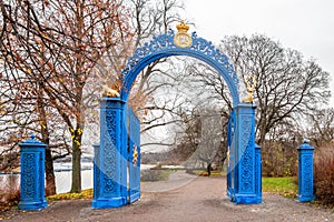 Beautiful vintage blue steel iron gate entrance to the public park Djurgarden in Stockholm Sweden.