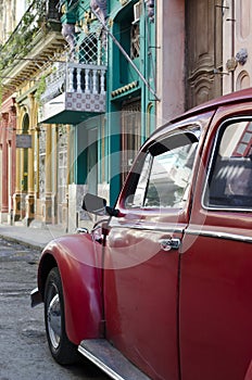 Old vintage american red car in the streets of colonial Havana, Cuba