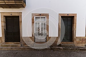 Beautiful vintage old styled wooden doors in Torre de Moncorvo streets in Portugal photo