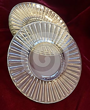 Beautiful Vintage Shiny Crystal Glass Dessert Plates on Red Velvet Background