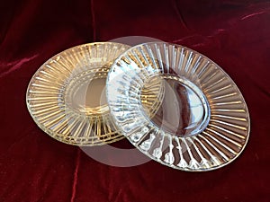 Beautiful Vintage Shiny Crystal Glass Dessert Plates on Red Velvet Background