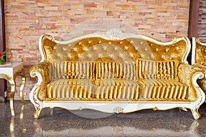 Beautiful vintage sofa next to wall