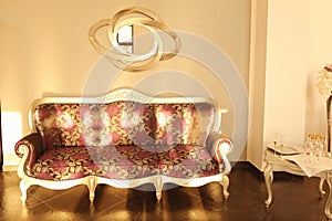 Beautiful vintage sofa next to wall