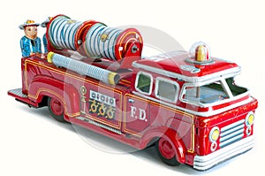 A beautiful vintage tin toy red firetruck