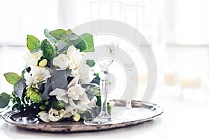 Beautiful vintage wedding decoration with champagne and white fl