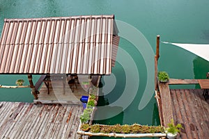 Beautiful vintage Wooden Pavilion , Evening time at water lake ,Tropical garden landscape, Ornamental plants in the waterfront