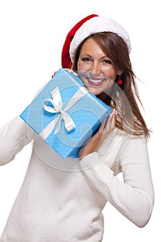 Beautiful vivacious woman with a Christmas gift