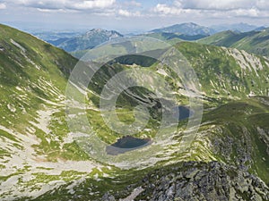 Beautiful vivid blue mountain lakes Horne and Dolne Jamnicke pleso with green mountain peaks view from the Jamnice sedlo