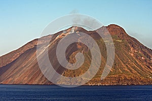 Beautiful volcanic island with green vegetation in the Mediterranean Sea on a clear sunny day