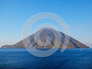 Beautiful volcanic island with green vegetation in the Mediterranean Sea on a clear sunny day