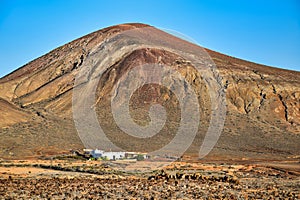 Beautiful volcanic landscape with a white house in front. Lanzarote , Canary Islands, Spain