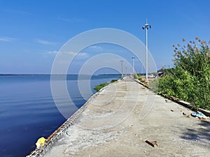 Beautiful walkway across Vembanad lake in kerala, India.