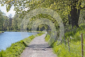 Beautiful walkway a long the water, Gota Kanal in Motala Sweden photo