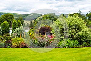 Beautiful walled, victorian garden with variety of flowers and trees