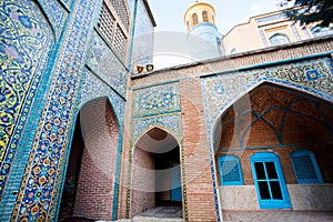 Beautiful walls with colorful tiles & minaret of Jameh mosque built 1812